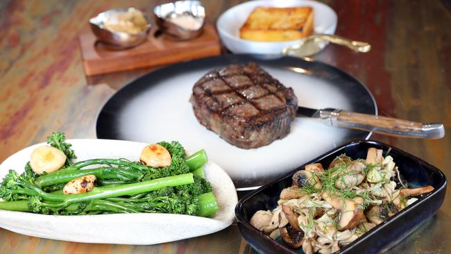 Gotham Grill’s Greenstone NZ Porterhouse with Broccolini, roasted garlic, lemon dressing and Sauteed wild mushrooms and Baked potato gratin. Photo by Richard Gosling