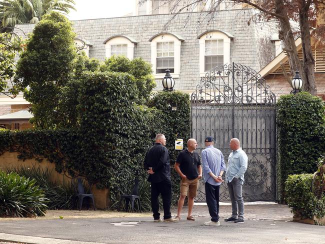 Security stand guard outside the home of Eddie Obeid who is being released from jail this morning. Family wait inside to greet him. Picture: Sam Ruttyn