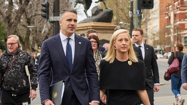 Premier Peter Malinausaks, with his wife Annabel West, walk along North Terrace, Adelaide, from Government House to Parliament House, North Tce, for the Proclamation of the ascension of King Charles III. Picture: Matt Loxton