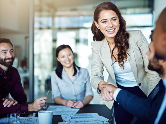 Cropped shot of two businesspeople shaking hands during a meeting in the boardroom