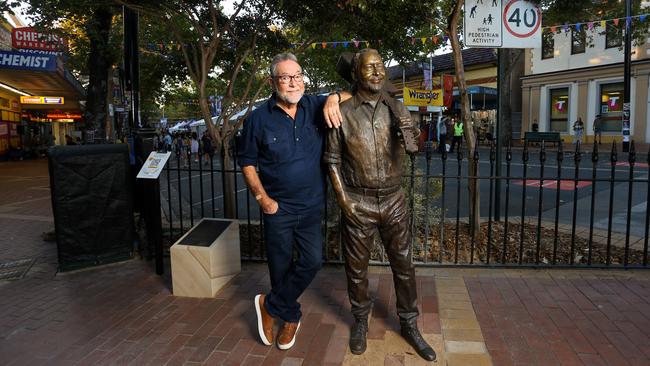 John Williamson with his life-size bronze statue in Tamworth. Picture: Lisa Maree Williams