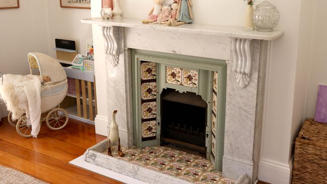 Original fireplaces can be found throughout the heritage home. Photo: Steve Pohlner.