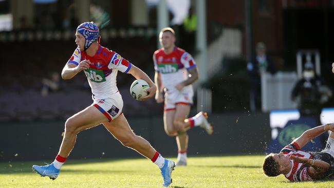 Churchie Old Boy Kalyn Ponga of the Knights slips the tackle of Victor Radley during the Round 18 NRL match between the Sydney Roosters and the Newcastle Knights at the Sydney Cricket Ground in Sydney, Saturday, July 20, 2019. Picture: AAP/Darren Pateman.