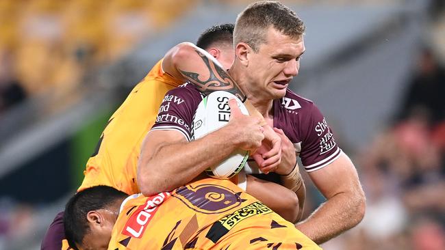 BRISBANE, AUSTRALIA - MAY 14: Tom Trbojevic of the Sea Eagles is tackled during the round 10 NRL match between the Manly Sea Eagles and the Brisbane Broncos at Suncorp Stadium on May 14, 2021, in Brisbane, Australia. (Photo by Bradley Kanaris/Getty Images)