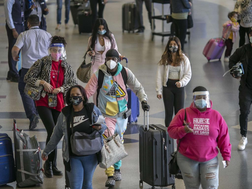 Holiday travellers at through Los Angeles international Airport on thanksgiving eve on November 25. Picture: David McNew/Getty Images/AFP