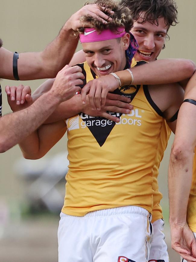 Connor McLeod is congratulated by his Glenelg teammates after kicking a goal against West Adelaide in Round 11. Picture: David Mariuz/SANFL