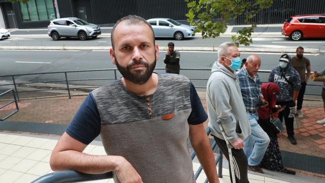 Uber driver Ahmed Saber queues at Centrelink in Bankstown in Sydney’s southwest. Picture: John Feder