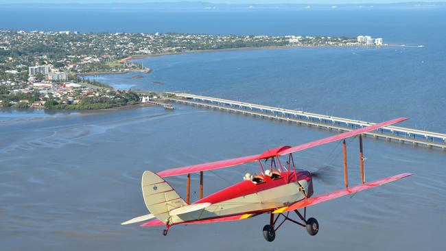 The Antique Airways Tiger Moth flying over Redcliffe. Photo: Antique Airways.