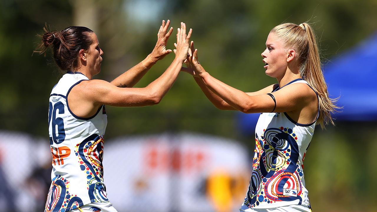 Chelsea Randall celebrates an Adelaide goal with Ashleigh Woodland. Picture: Getty Images