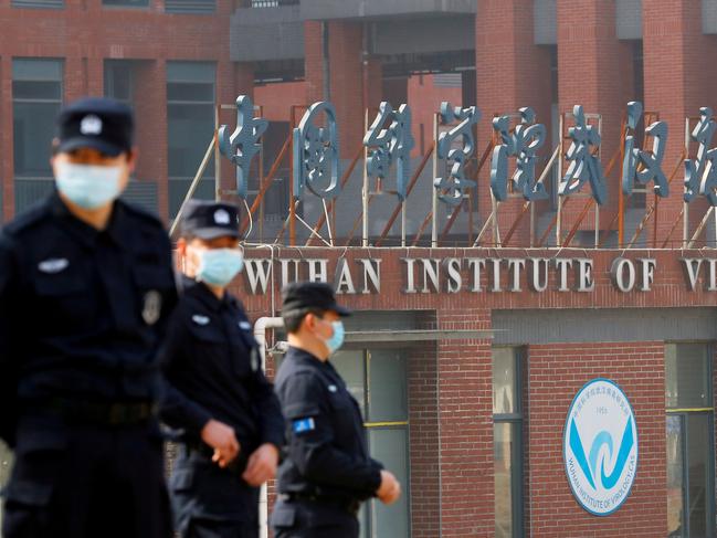 EMBARGO FOR TWAM 29 JUL 2023. FEE MAY APPLY FILE PHOTO: Security personnel keep watch outside the Wuhan Institute of Virology during the visit by the World Health Organization (WHO) team tasked with investigating the origins of the coronavirus disease (COVID-19), inÃÂ Wuhan, Hubei province, China February 3, 2021. REUTERS/Thomas Peter/File Photo