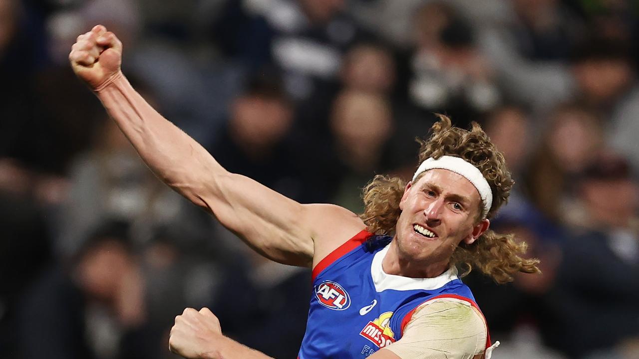 MELBOURNE, AUSTRALIA - August 26 , 2023. AFL . Bulldog Aaron Naughton celebrates a 4th quarter goal during the round 24 match between Geelong and the Western Bulldogs at GMHBA Stadium in Geelong, Australia. Photo by Michael Klein.
