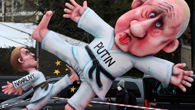 A carnival float depicting Russian opposition leader Alexei Navalny kicking the balls of Russian President Vladimir Putin during a slimmed down version of the traditional Rose Monday parade on February 15, 2021 in Dusseldorf, Germany. Picture: Ina Fassbender / AFP.