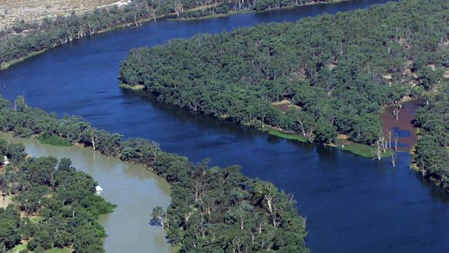 Aerial picture of the convergence of the muddy Darling River (L) and the Murray River (R) at Wentworth, NSW. In the forground is the lock and the weir.