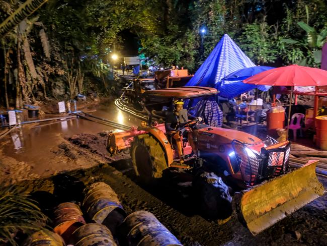 A bulldozer clears out the surface of the drilling well site at the entrance of the cave. Picture: Linh Pham/Getty Images