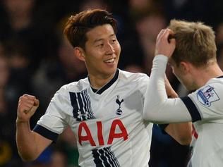 Tottenham Hotspur's South Korean striker Son Heung-Min (L) celebrates scoring their second goal during the English Premier League football match between Chelsea and Tottenham Hotspur at Stamford Bridge in London on May 2, 2016. / AFP PHOTO / GLYN KIRK / RESTRICTED TO EDITORIAL USE. No use with unauthorized audio, video, data, fixture lists, club/league logos or 'live' services. Online in-match use limited to 75 images, no video emulation. No use in betting, games or single club/league/player publications. /