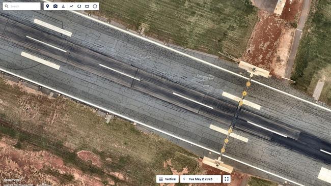 Urgent runway patching from 2021. Aerial imagery by Nearmap.