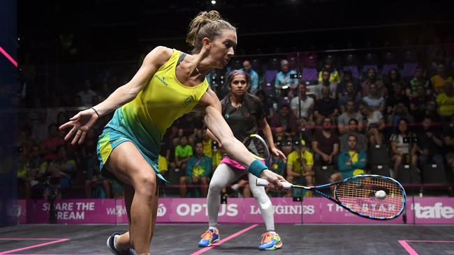 Australia's Donna Urquhart hits a return during her 3-0 victory over Faiza Zafar of Pakistan yesterday. Photo: AFP