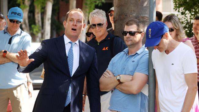 Matt Lancashire with interested bidders at the auction of the multimillion-dollar riverside apartment of developer David Blanck. Picture: Liam Kidston