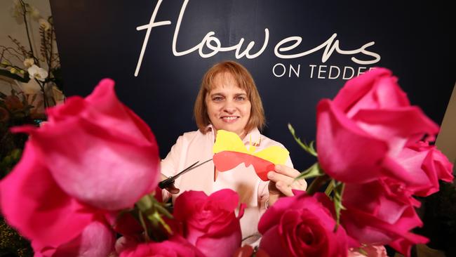 Margot de Groot making paper butterflies at Flowers on Tedder ahead of The Main Beach Flower Show. Picture: Jason O'Brien