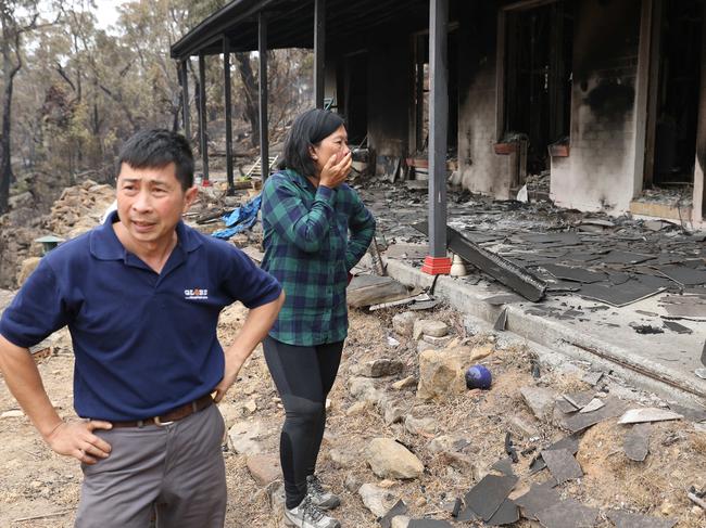 Helena and Justin Cam at their burnt out house on Station Street in Balmoral. Despite their best attempt, they were unable to save their house on Saturday. Picture Rohan Kelly