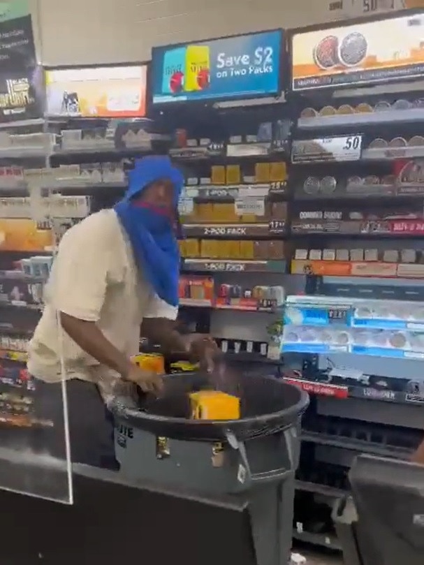 The man was seen filling up a large bin with cigarettes. Picture: Twitter