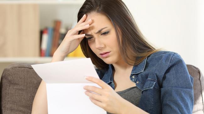 woman shocked at electricity bill generic