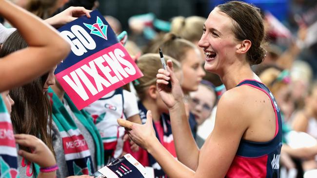 MELBOURNE, AUSTRALIA — FEBRUARY 18: Emily Mannix of the Vixens signs autographs after a win during round one of the Super Netball match between the Vixens and Magpies at Hisense Arena on February 18, 2017 in Melbourne, Australia. (Photo by Robert Prezioso/Getty Images)