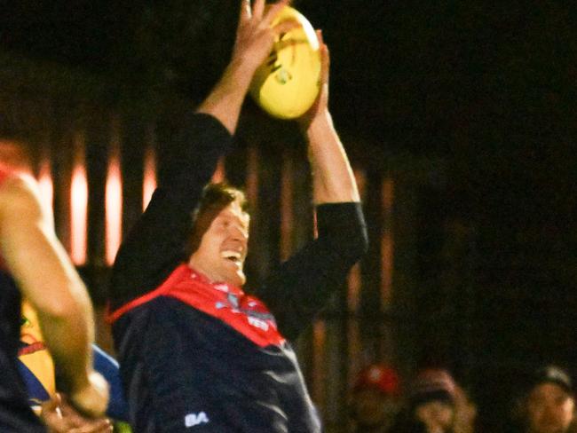 Former Port Adelaide captain Tom Jonas takes a defensive mark for the Lockleys Div 12 Ressies. Picture: Brenton Edwards