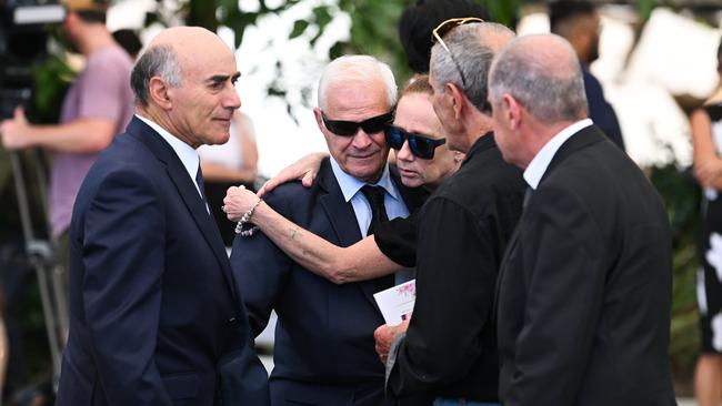 Victor White, centre, is supported by mourners at his wife’s funeral. Picture: Dan Peled / NCA Newswire