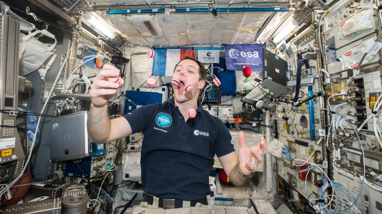 French Austronaut Thomas Pesquet juggling and eating macarons in 2017 on the International Space Station. The biscuits were specially modified for consumption in space by French master pastry chef Pierre Herme. Picture: AFP/European Space Agency/NASA