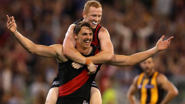 Josh Green jumps on Joe Daniher. Picture: Michael Klein