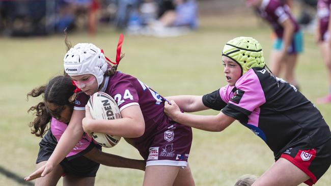 Dalby’s Mia Johnson is wrapped up by the Valleys defence during a Walker Weekend Challenge match at John McDonald Sports Complex. Picture: Kevin Farmer