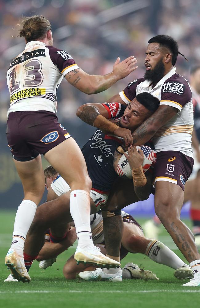 Pat Carrigan and Payne Haas tackle Spencer Leniu during the round 1 clash. Picture: Ezra Shaw/Getty Images