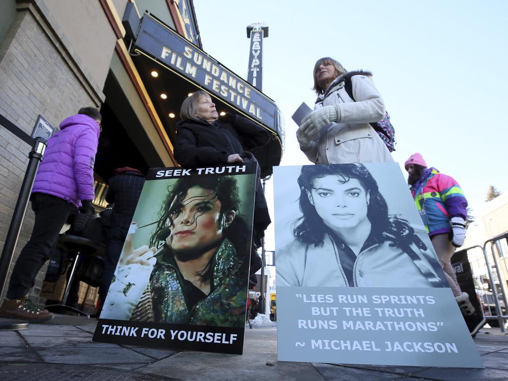 Michael Jackson fans Brenda Jenkyns and Catherine Van Tighem drove from Canada to protest at the premiere of Leaving Neverland at the Sundance Film Festival in Utah, US. Picture: Danny Moloshok/Invision