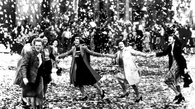 Frances Meinrath, Joyce Gibbs, Jean Hughes, Daphne Payne, Clare Taylor, Norah Smith and Mary Wilson join Australia’s street celebrations on Victory in the Pacific Day in 1945.