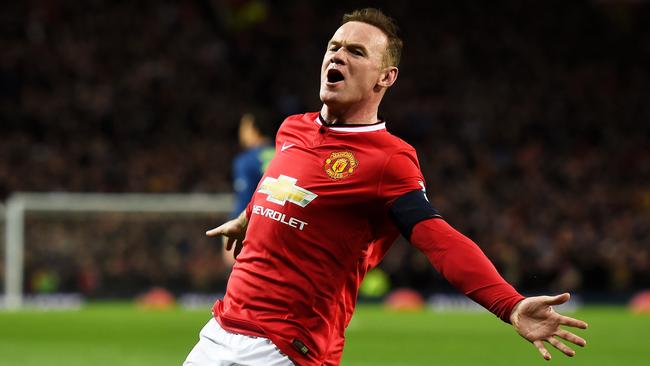 MANCHESTER, ENGLAND - MARCH 09: Wayne Rooney of Manchester United celebrates after scoring a goal to level the scores at 1-1 during the FA Cup Quarter Final match between Manchester United and Arsenal at Old Trafford on March 9, 2015 in Manchester, England. (Photo by Laurence Griffiths/Getty Images)