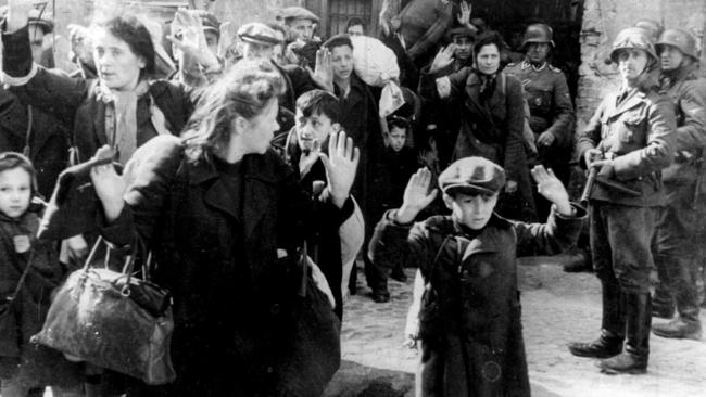 Brutality beyond words … German soldiers round up Polish Jewish women and children during the Holocaust.