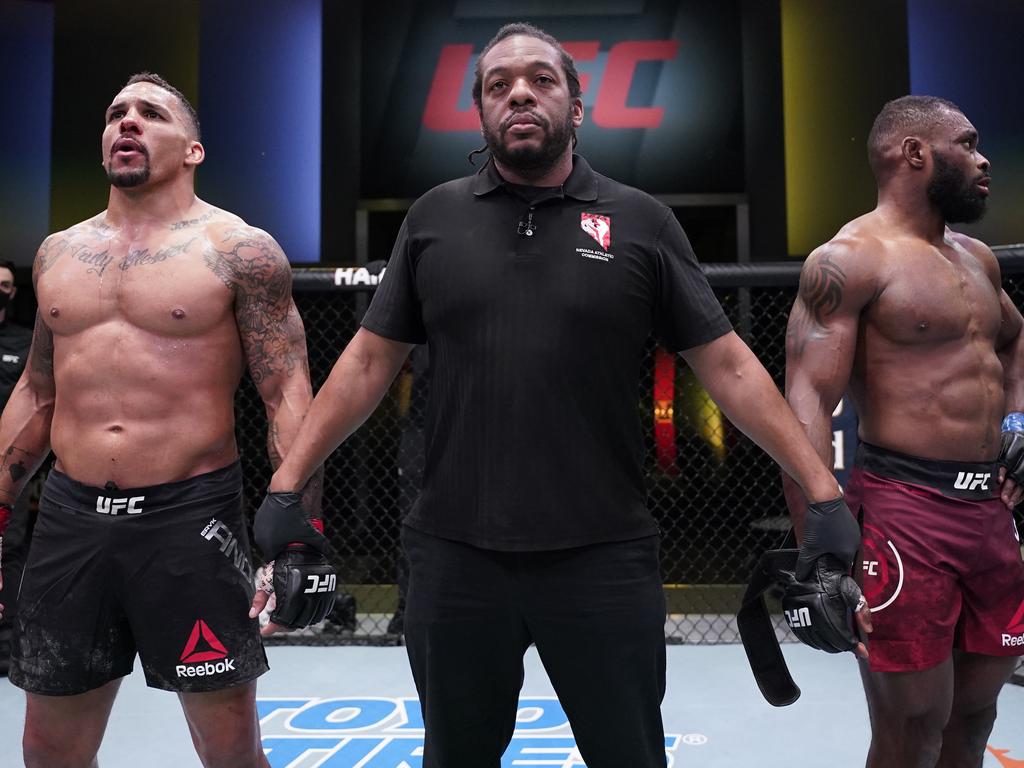 Eryk Anders and Darren Stewart of England react after referee Herb Dean declares their fight a no-contest.