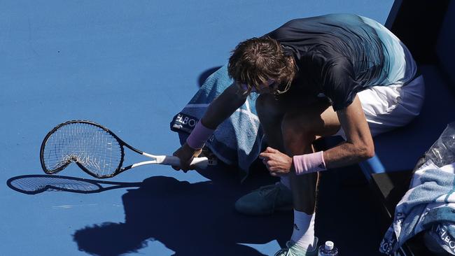 Alexander Zverev smashes his racket. Picture: Kin Cheung/AP