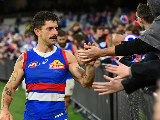 MELBOURNE, AUSTRALIA - APRIL 08: Tom Liberatore of the Bulldogs high fives fans after winning the round four AFL match between Richmond Tigers and Western Bulldogs at Melbourne Cricket Ground, on April 08, 2023, in Melbourne, Australia. (Photo by Quinn Rooney/Getty Images)