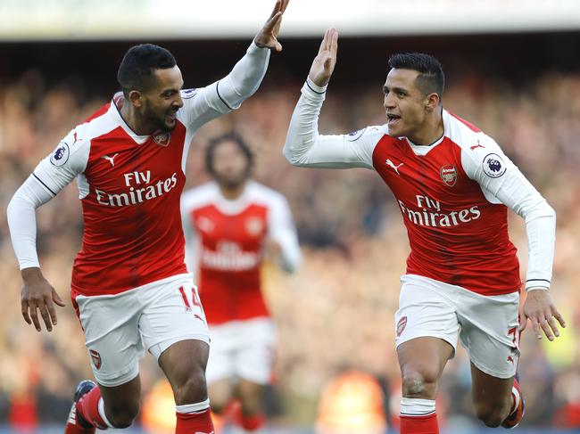 Arsenal's Alexis Sanchez, right, and Arsenal's Theo Walcott celebrates after scoring during the English Premier League soccer match between Arsenal and Bournemouth at Emirates stadium in London, Sunday, Nov. 27, 2016.(AP Photo/Frank Augstein)