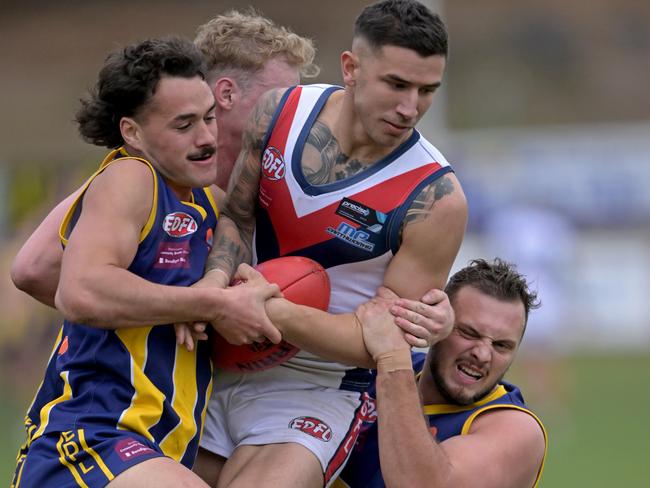 EDFL: St Albans’ Jake Galea is wrapped up. Picture: Andy Brownbill