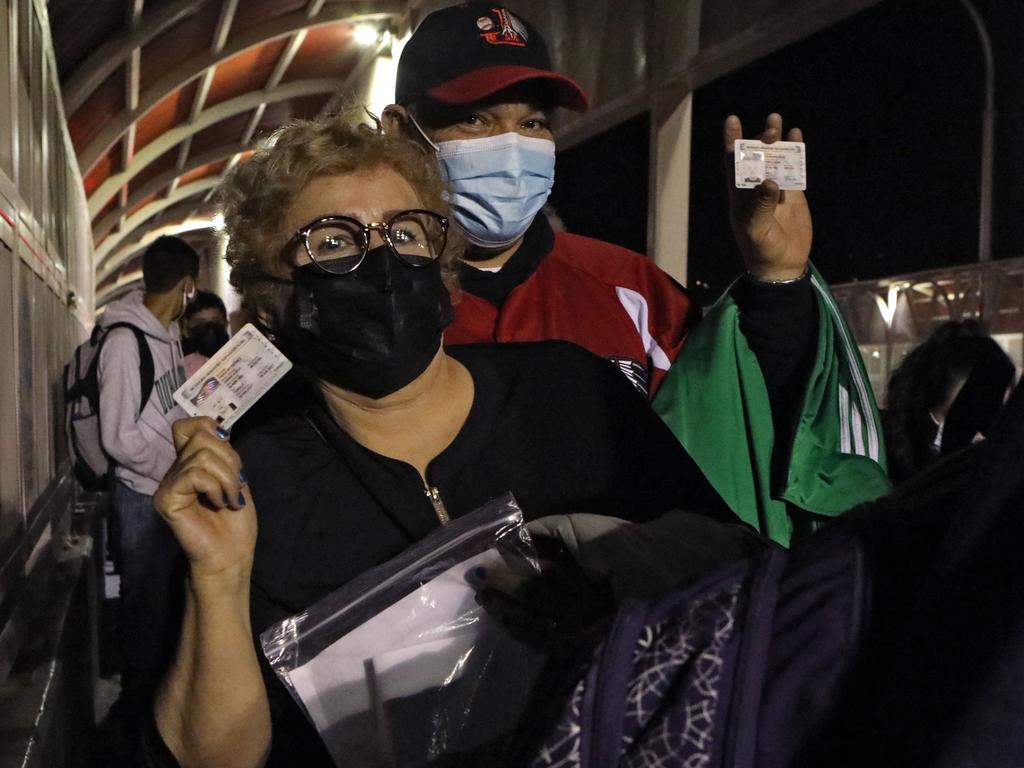 Mexicans show their tourist visas as they wait to enter to the United States after the US reopened its land and air borders to foreign visitors fully vaccinated against Covid. Picture: AFP