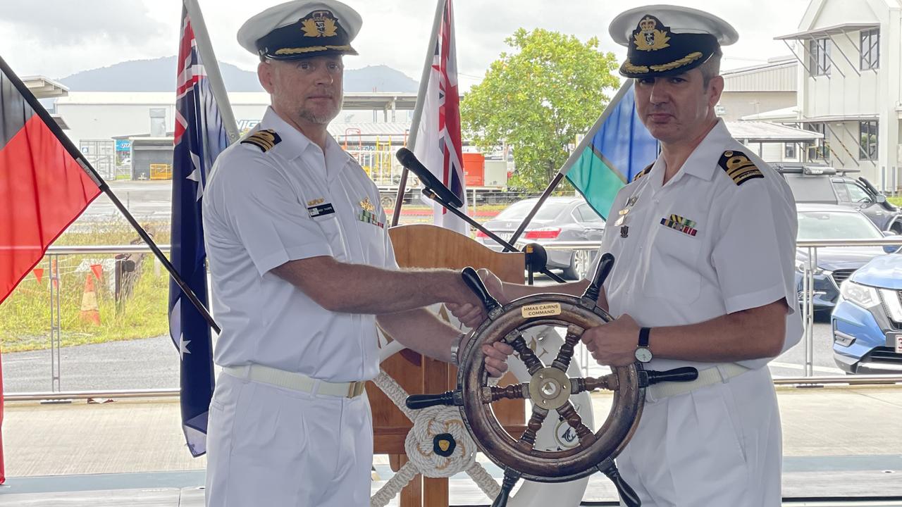 Commander Alfonso Santos hands the wheel of command at HMAS Cairns over to new Commanding Officer Andrew Thorpe. Photo: Dylan Nicholson.