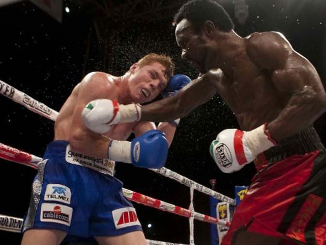 Boxers Lovemore Ndou (R) against opponent Saul Alvarez in 2010.
