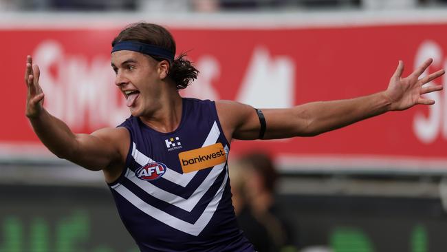 GEELONG, AUSTRALIA - MARCH 15: Murphy Reid of the Dockers celebrates kicking a goal during the round one AFL match between Geelong Cats and Fremantle Dockers at GMHBA Stadium, on March 15, 2025, in Geelong, Australia. (Photo by Daniel Pockett/Getty Images)