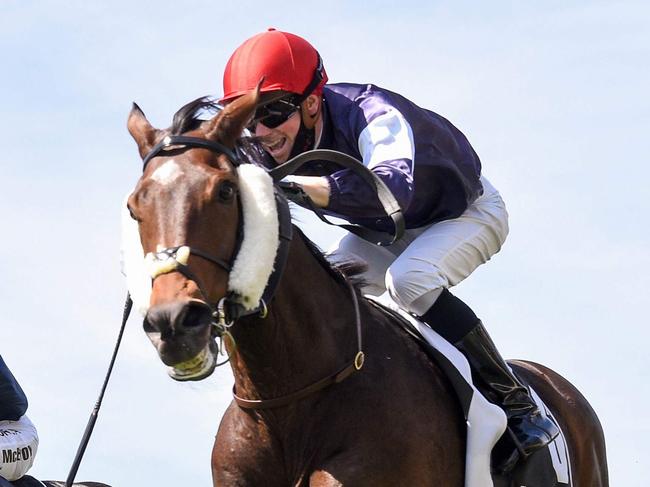 This handout photo taken and received from Racing Photos on November 3, 2020 shows Twilight Payment ridden by Jye McNeil (R) heading to victory in front of empty grandstands in the Melbourne Cup at the Flemington Racecourse in Melbourne. (Photo by Handout / RACING PHOTOS / AFP) / EDITORS NOTE ----RESTRICTED TO EDITORIAL USE MANDATORY CREDIT " AFP PHOTO / RACING PHOTOS" NO MARKETING NO ADVERTISING CAMPAIGNS - DISTRIBUTED AS A SERVICE TO CLIENTS - NO ARCHIVES