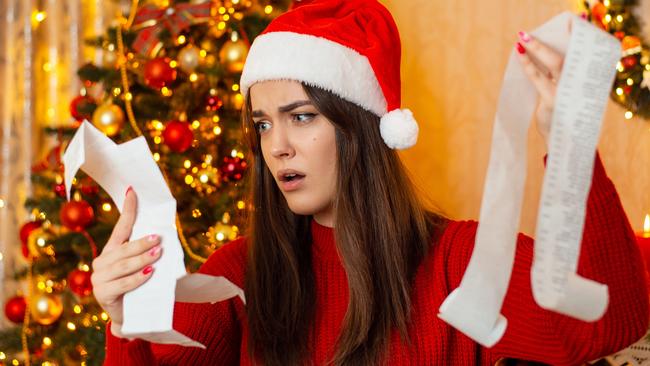 Christmas preparations, concept of much expenses on Christmas presents and decorations; spending surprise shock generic