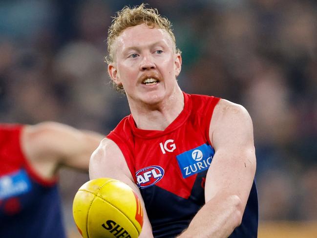 MELBOURNE, AUSTRALIA - MAY 04: Clayton Oliver of the Demons handpasses the ball during the 2024 AFL Round 08 match between the Melbourne Demons and the Geelong Cats at The Melbourne Cricket Ground on May 04, 2024 in Melbourne, Australia. (Photo by Dylan Burns/AFL Photos via Getty Images)