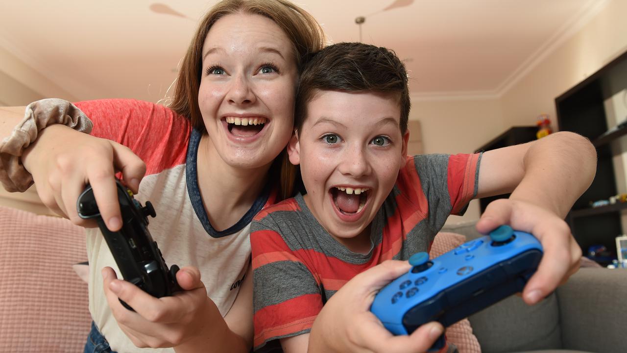 Imogen, 18, and brother Brady, 11, say gaming has helped them stay in touch with friends during COVID. Picture: Josie Hayden